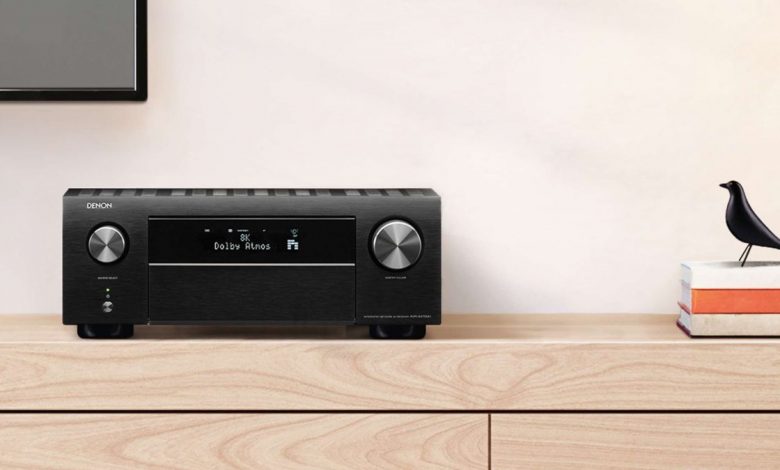 best AV receivers: Denon AVR-X4700 on wooden sideboard